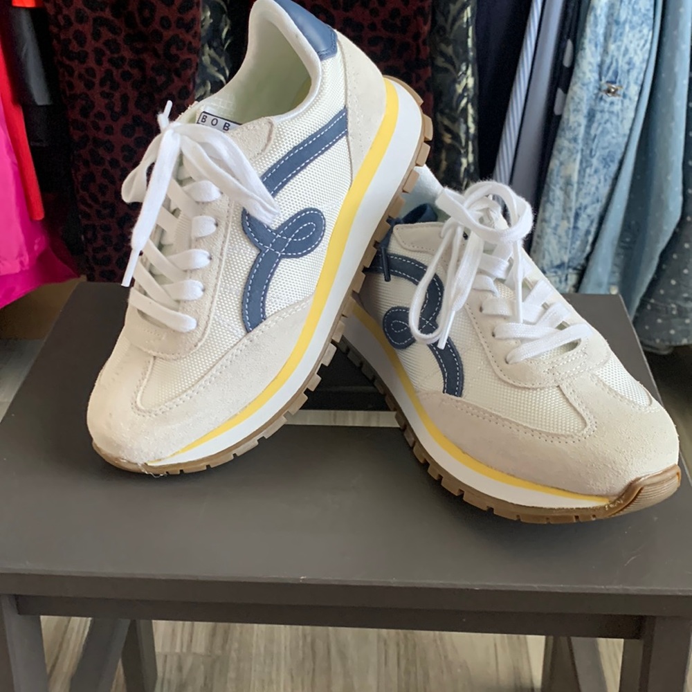 White with Blue and Yellow Sketchers Sneakers